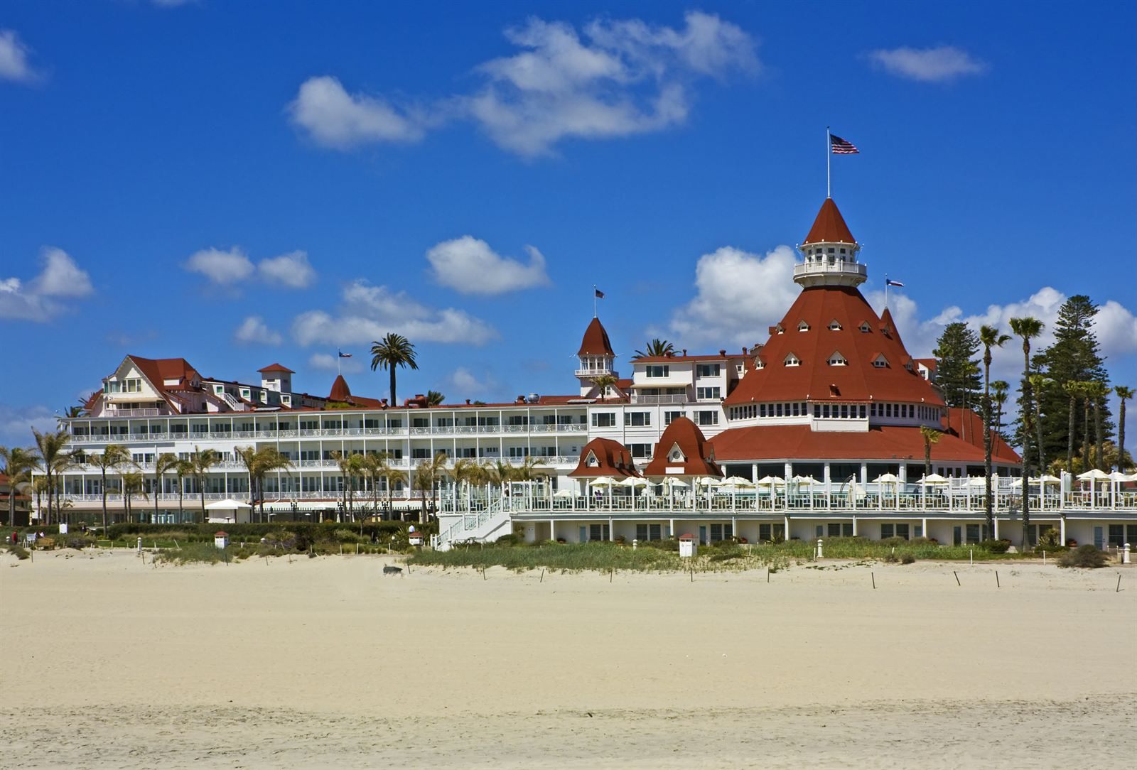 The red-roofed Hotel del Coronado behind Coronado Beach in San Diego, one of the classic things to do in Southern California