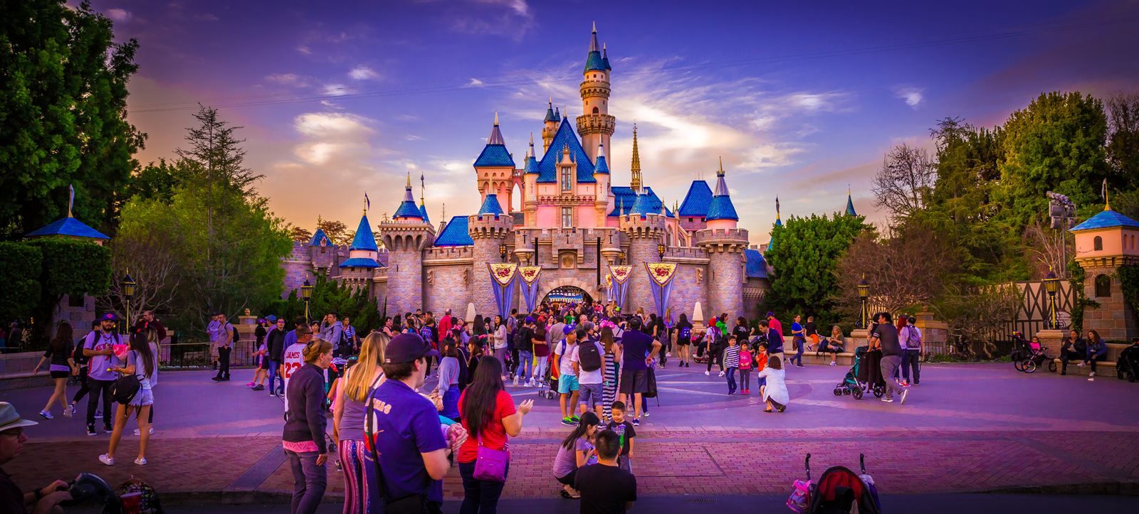 Families in front of Sleeping Beauty Castle at Disneyland, a favorite of things to do in Southern California with kids